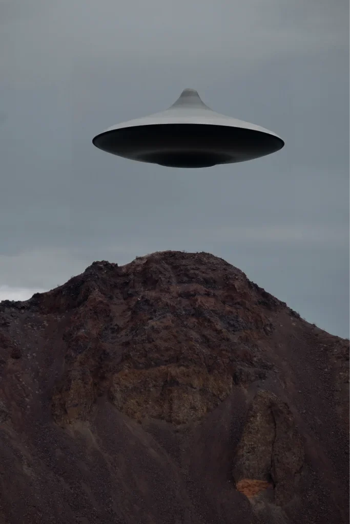 A flying saucer over a mountain